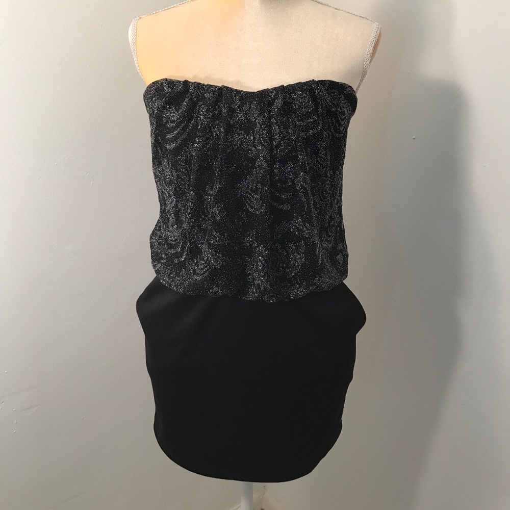 Black dress with side pockets.